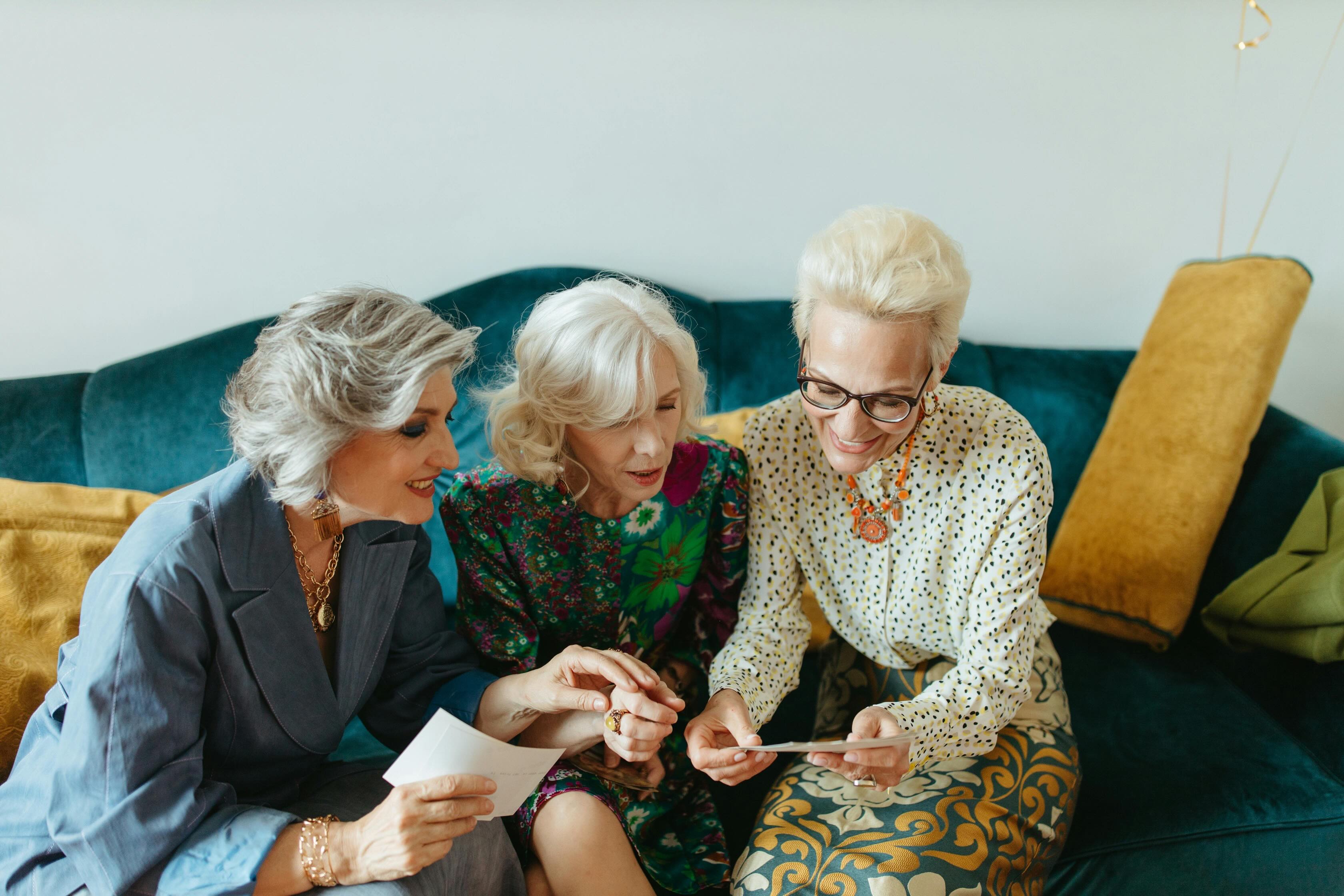 Women looking fondly at photographs